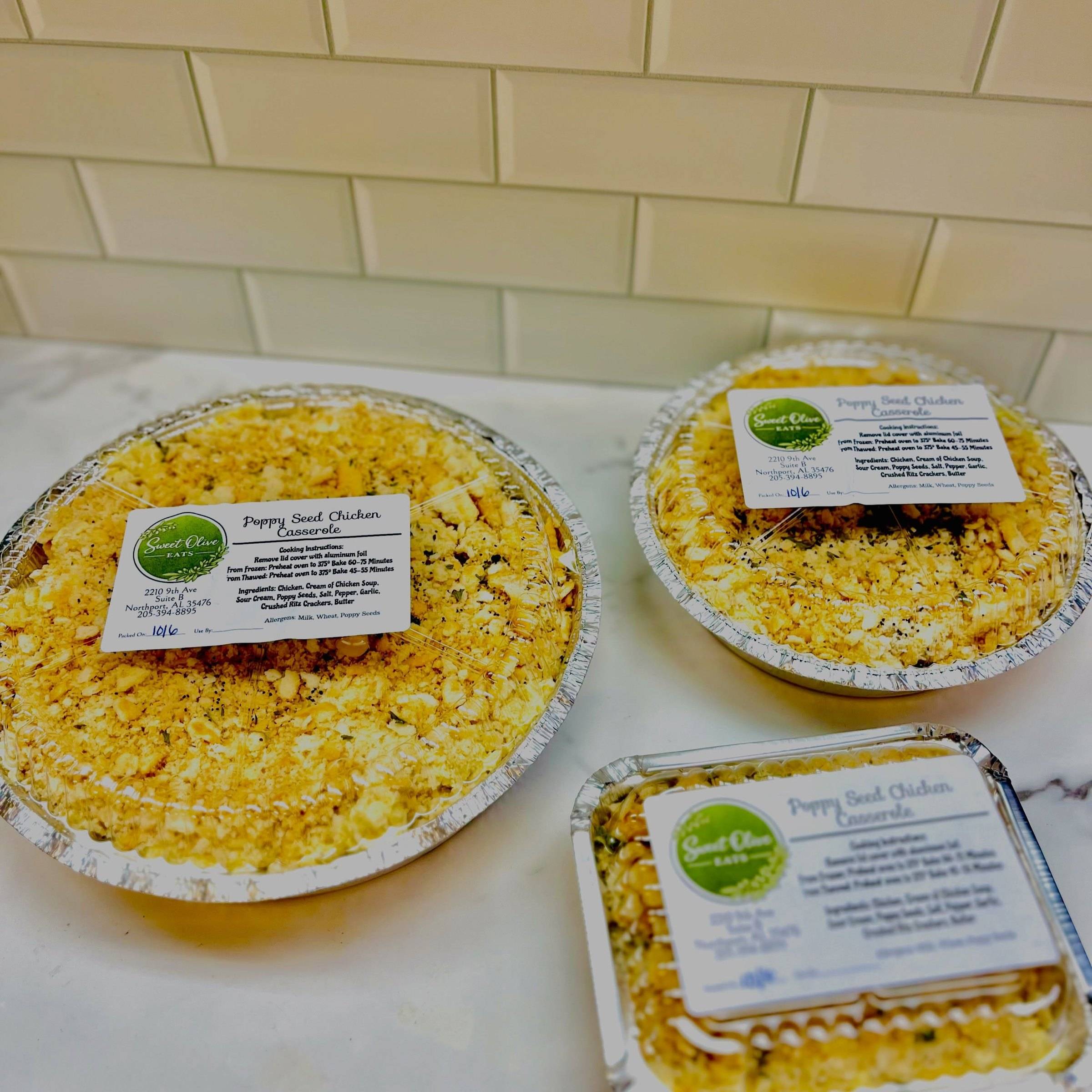 Poppy Seed Chicken casseroles in foil pans, each with a Sweet Olive cooking label